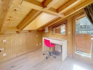 Discover the charm of this cozy attic space, perfect for a home office or a relaxing retreat.