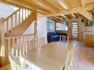 This charming property boasts a warm and inviting interior with exposed wooden beams and a cozy atmosphere.