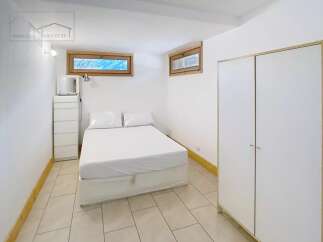Discover this cozy bedroom featuring a comfortable bed, perfect for relaxation.