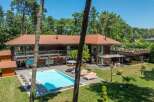 This stunning property boasts a luxurious outdoor pool, perfect for relaxation and entertainment.