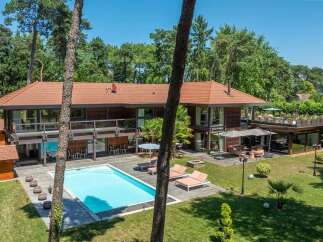 This stunning property boasts a luxurious outdoor pool, perfect for relaxation and entertainment.