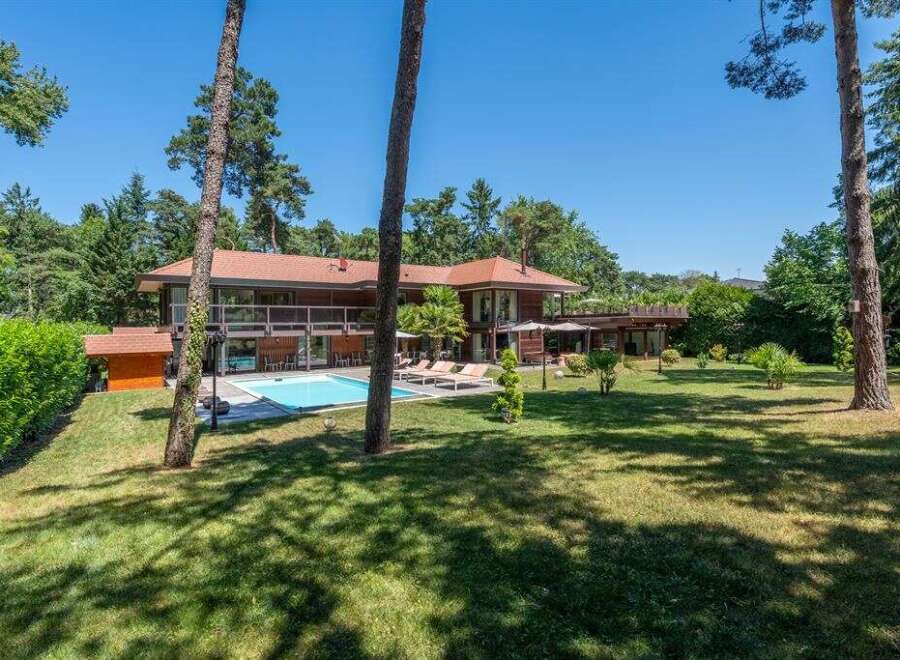 Discover luxury living in this stunning property featuring a private pool and expansive outdoor space.