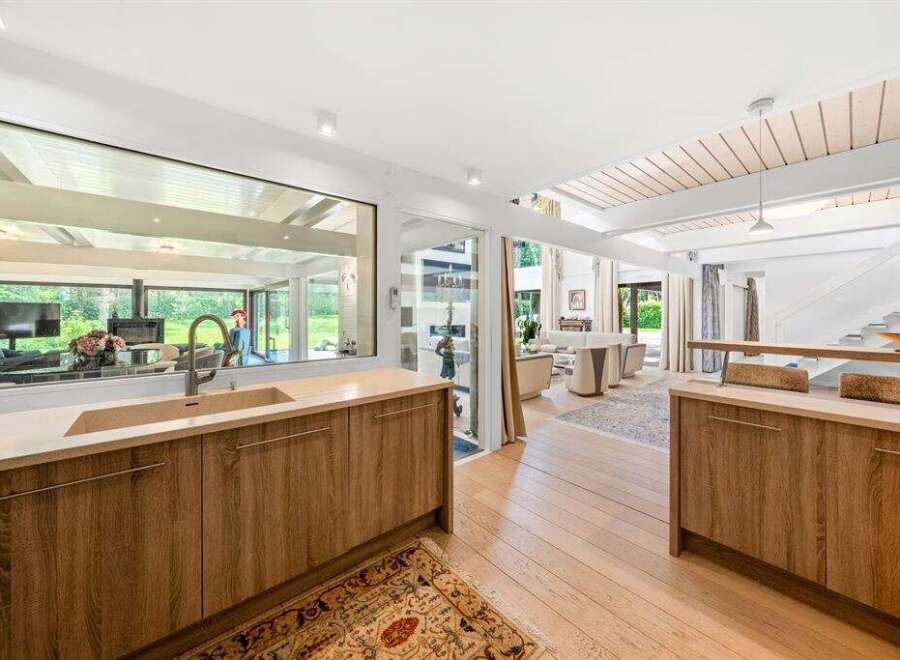 Step into luxury with this stunning modern home! Featuring a gourmet kitchen with sleek cabinetry and a spacious layout, perfect for entertaining.