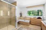 This stunning bathroom features a modern design with a luxurious feel.