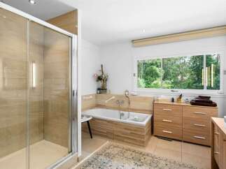 This stunning bathroom features a modern design with a luxurious feel.