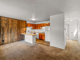 Discover this inviting property featuring a well-equipped kitchen with ample cabinet space and modern appliances.