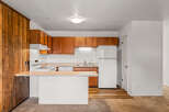 Discover this charming kitchen with warm wood cabinetry and a functional layout.