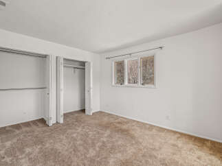 Discover the charm of this inviting bedroom, featuring a spacious closet and ample storage.