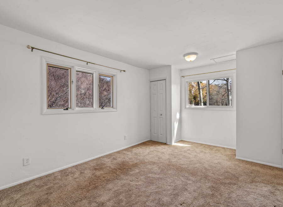 This inviting bedroom offers a bright and airy atmosphere, perfect for relaxation.