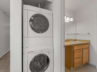 This property features a convenient stacked washer and dryer, perfect for efficient laundry days.