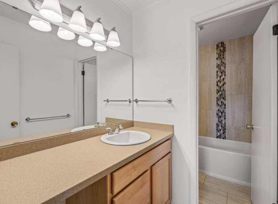 This inviting bathroom features a clean and modern design, perfect for a relaxing retreat.