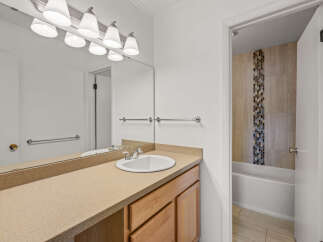 This inviting bathroom features a clean and modern design, perfect for a relaxing retreat.