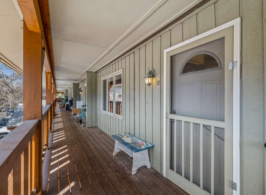 This charming property features a welcoming porch, perfect for enjoying the outdoors.