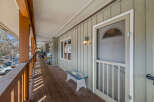 This charming property features a welcoming porch, perfect for enjoying the outdoors.