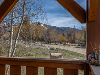Enjoy breathtaking mountain views from this charming property.