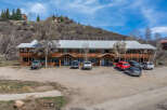 Discover a charming multi-unit property nestled in a picturesque setting.