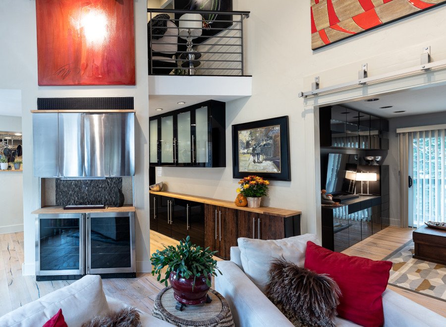 This stunning home boasts an open-concept living area with a unique blend of modern and rustic design elements.