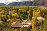 Nestled amidst the vibrant autumn foliage, this property offers a serene escape with stunning views.