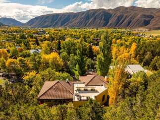 Nestled amidst the vibrant autumn foliage, this property offers a serene escape with stunning views.