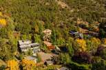 Nestled amidst a vibrant tapestry of autumn foliage, this stunning property offers a serene escape.