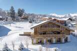 Experience the epitome of alpine luxury in this stunning chalet nestled amidst a winter wonderland.