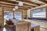 Experience the warmth of this stunning kitchen, featuring rustic wooden elements and a modern design.