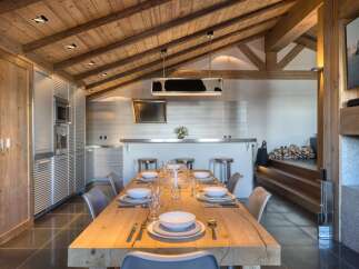 Experience luxury living in this stunning property, featuring a beautifully designed dining area.