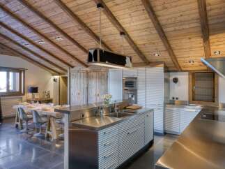 This stunning kitchen boasts a unique blend of rustic charm and modern design.