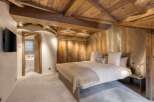 Experience rustic elegance in this stunning bedroom.