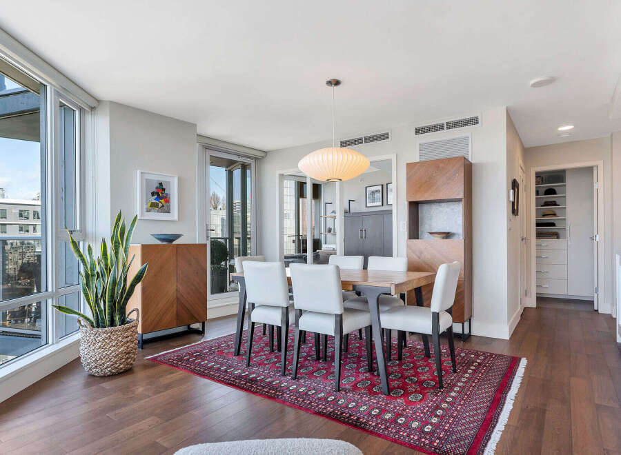 Experience luxury living in this stunning dining area, featuring a modern design with a touch of elegance.