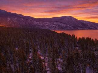Experience the tranquility of this stunning property nestled in a serene, snow-covered landscape.