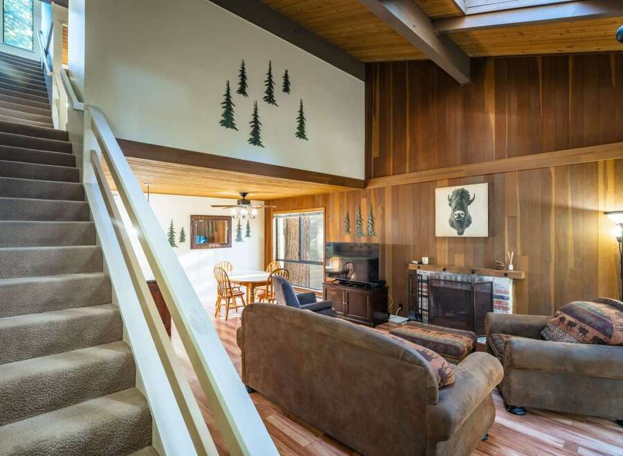 Step into this inviting home featuring a cozy living room with a fireplace, perfect for relaxing evenings.
