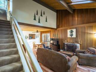 Step into this inviting home featuring a cozy living room with a fireplace, perfect for relaxing evenings.