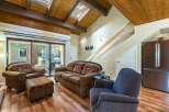 Step into this inviting living space, featuring a cozy sofa and armchairs perfect for relaxation.