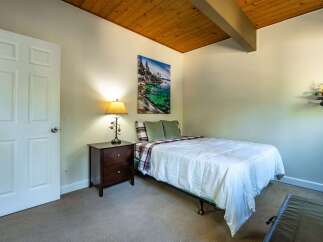 This cozy bedroom features a comfortable bed, perfect for a relaxing retreat.