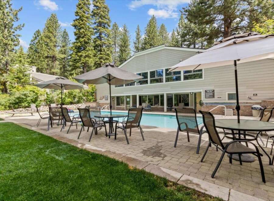 Enjoy the ultimate relaxation at this stunning property featuring a refreshing pool and comfortable outdoor seating.