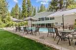 Enjoy the ultimate relaxation at this stunning property featuring a refreshing pool and comfortable outdoor seating.