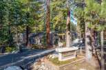 Discover the charm of Forest Pines Condominiums, nestled amidst towering trees.