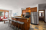 This stunning property boasts a modern kitchen with stainless steel appliances and a breakfast bar, perfect for entertaining.