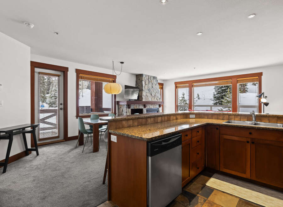 This stunning property boasts a modern kitchen with stainless steel appliances and granite countertops, perfect for culinary enthusiasts.