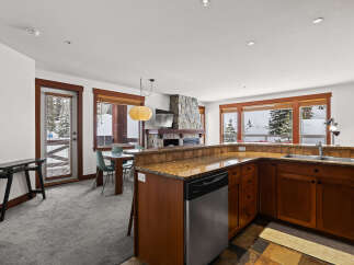 This stunning property boasts a modern kitchen with stainless steel appliances and granite countertops, perfect for culinary enthusiasts.