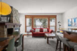 This stunning living space features a cozy fireplace, perfect for chilly evenings.