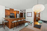 This stunning property boasts a modern kitchen with stainless steel appliances and a breakfast bar, perfect for entertaining.