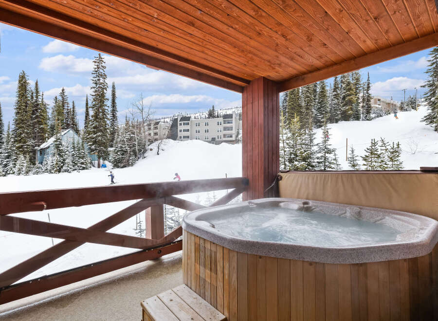 Enjoy breathtaking mountain views from this luxurious hot tub.
