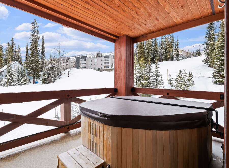 Enjoy breathtaking mountain views from this luxurious property featuring a private hot tub.