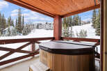 Enjoy breathtaking mountain views from this luxurious property featuring a private hot tub.