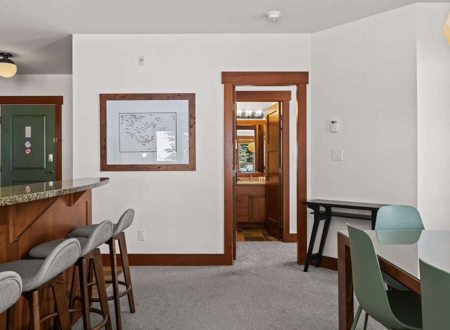 Step into this inviting space, featuring a stylish bar area perfect for entertaining.