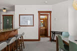 Step into this inviting space, featuring a stylish bar area perfect for entertaining.
