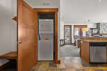 This stunning property boasts a convenient laundry area with a stacked washer and dryer, perfect for modern living.