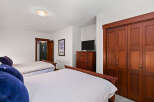 This inviting bedroom features two comfortable beds, perfect for accommodating guests or family.